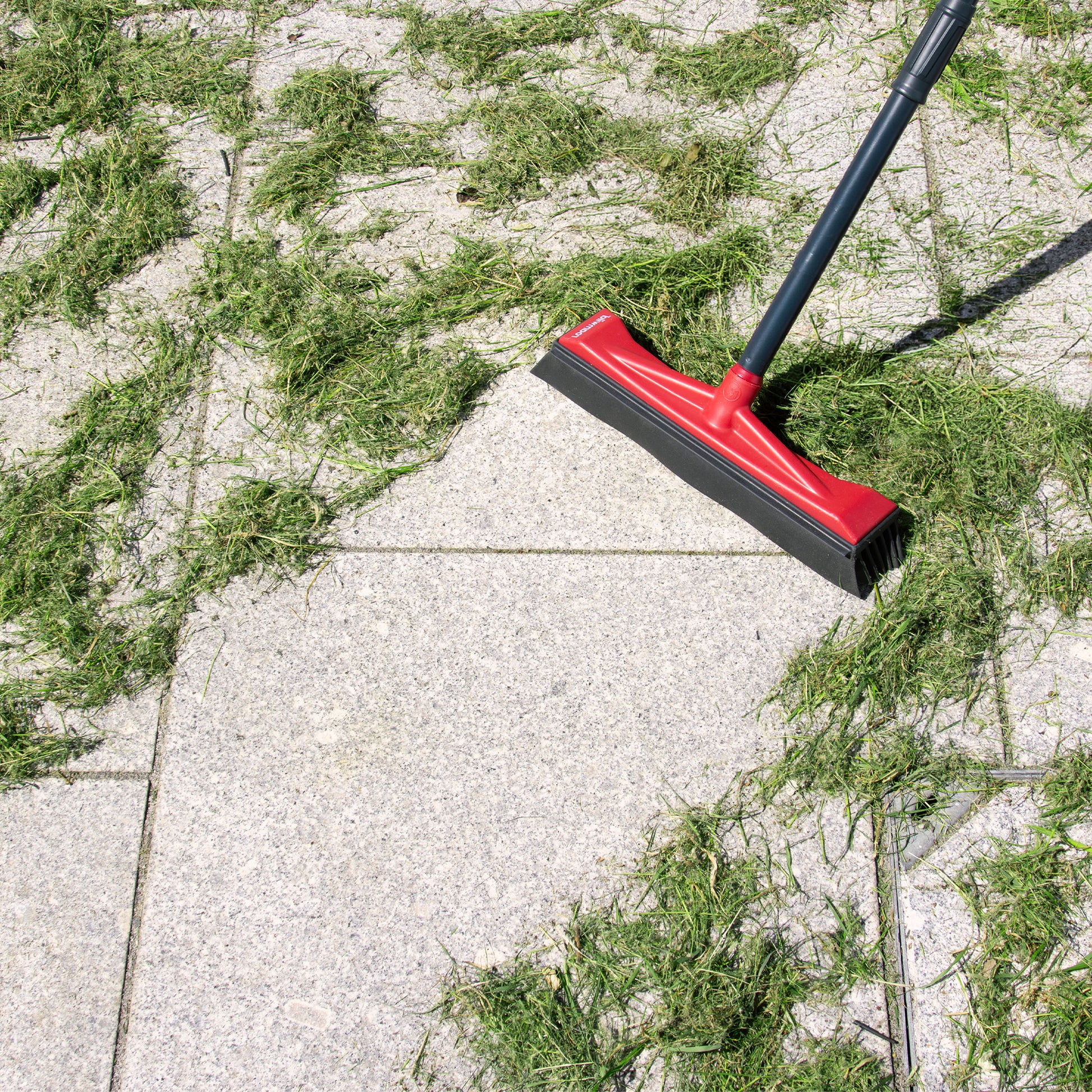 Roamwild garden broom sweeping leaves off a patio
